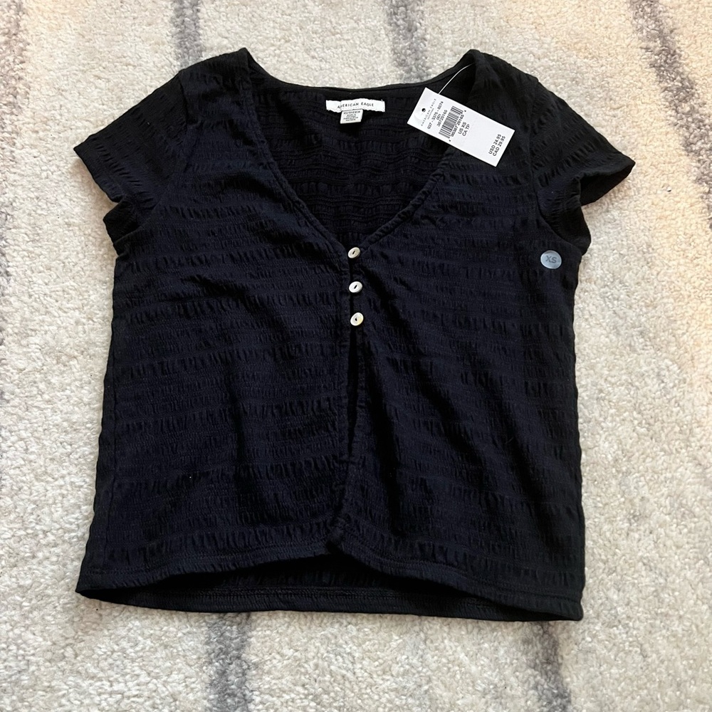 American Eagle black button front split hem tee